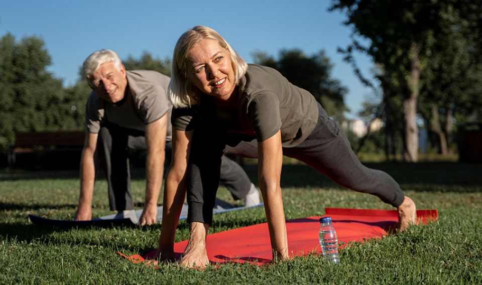 older couple stretching outside