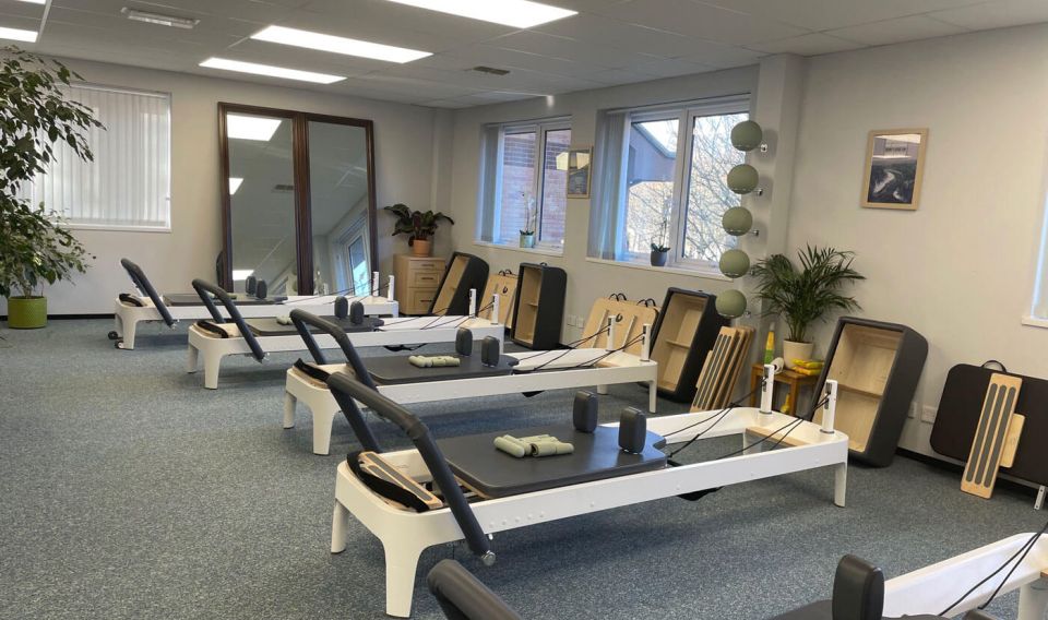 a reformer pilates class in session